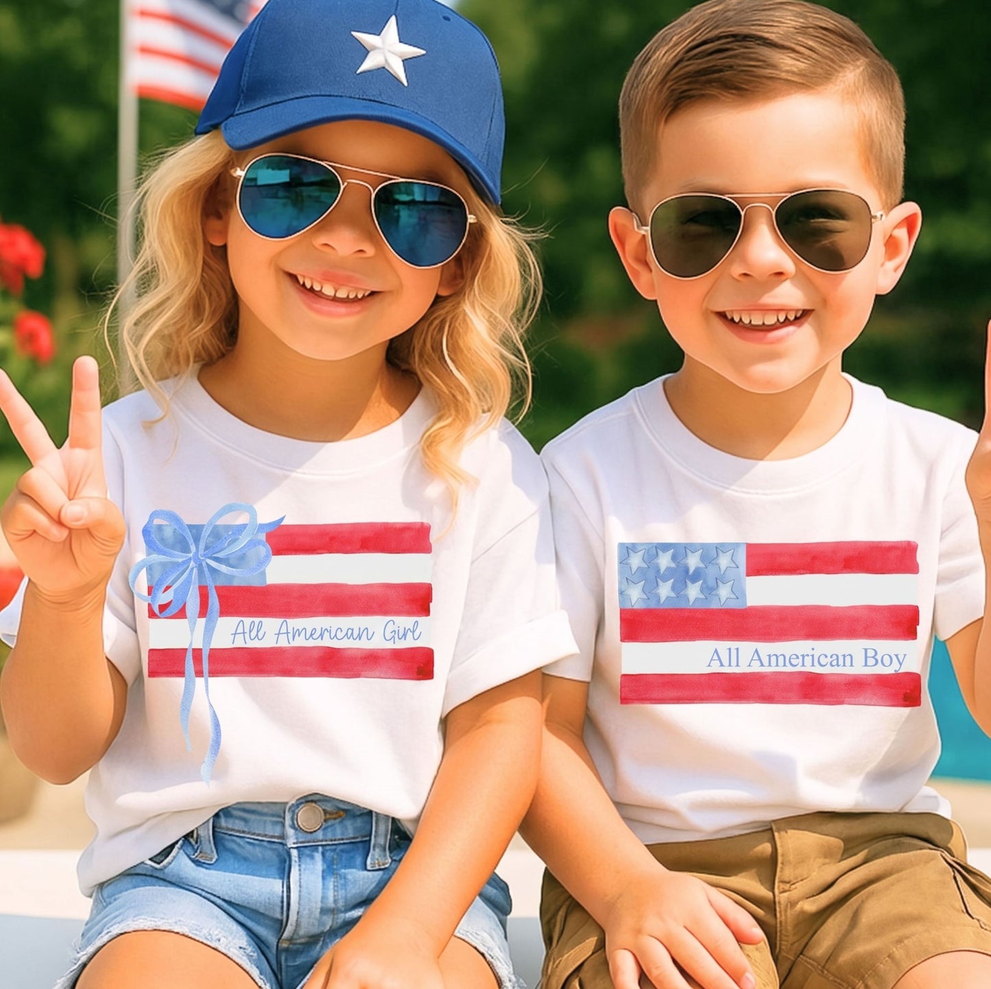 Two children wearing 'All American Girl' and 'All American Boy' t-shirts with American flag designs.