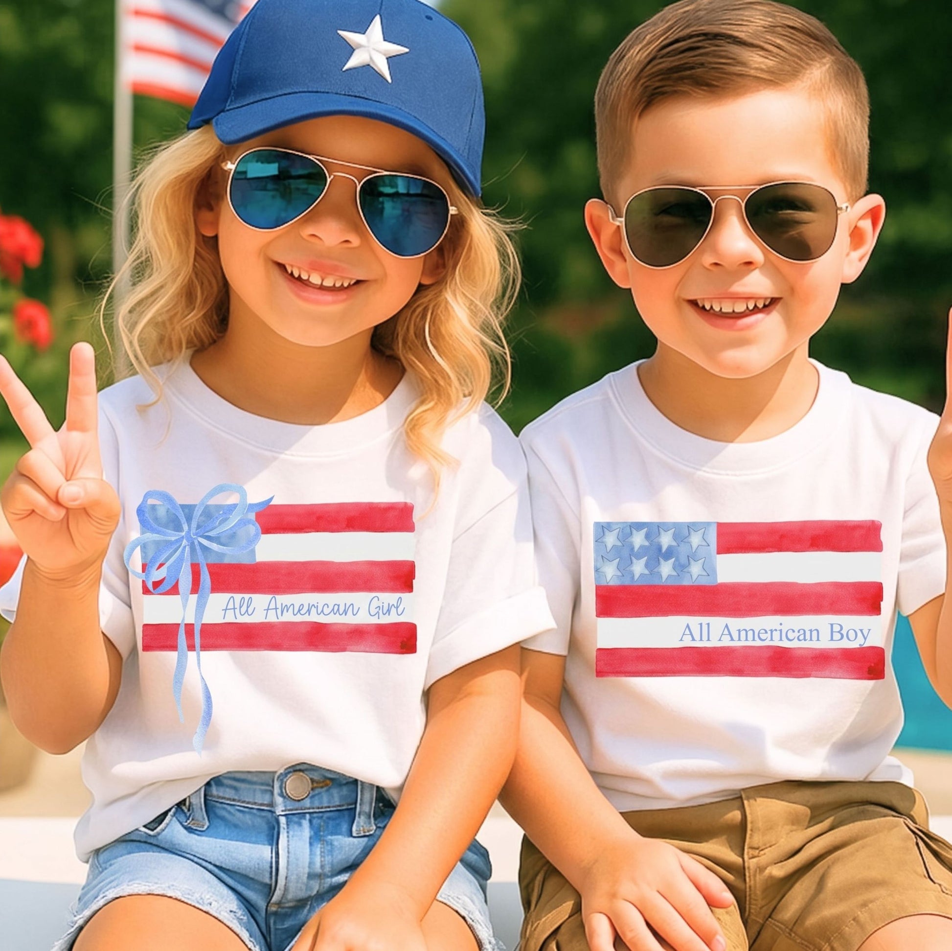 Two children wearing 'All American Girl' and 'All American Boy' t-shirts with American flag designs.