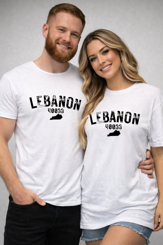 Man and woman wearing white t-shirts with 'LEBANON 40033' text, standing close together against a plain background.