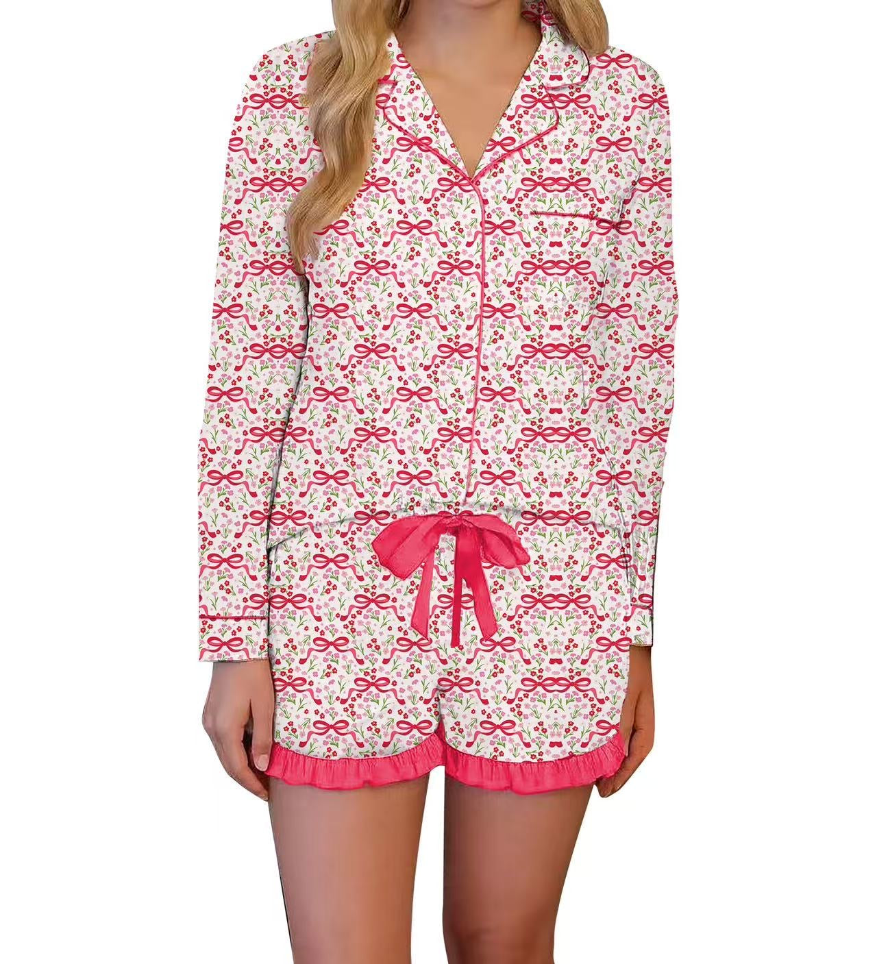 Woman wearing a pajama set with pink bows on a white background