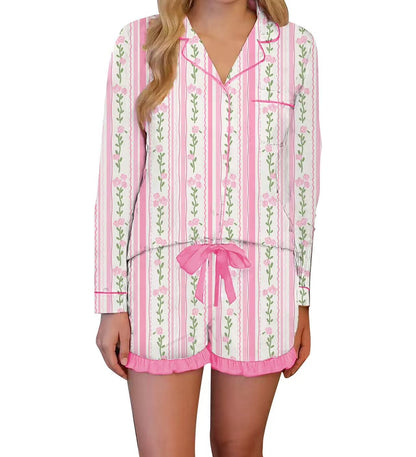 Pink and white striped pajama set with floral patterns on a white background