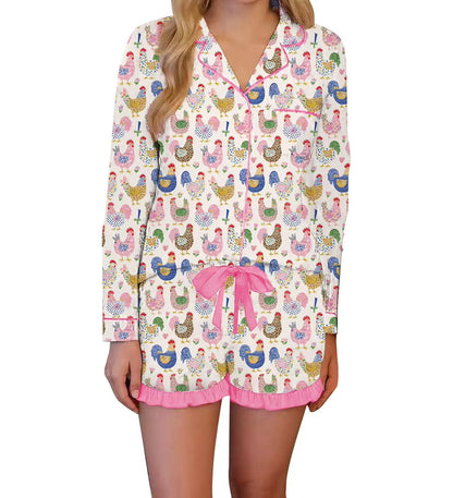 Woman wearing a pajama set with chicken pattern on a white background